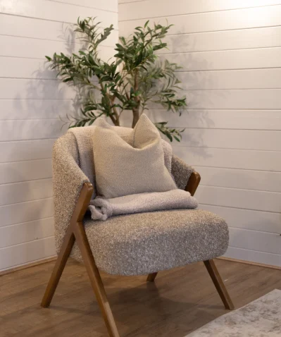 Comfortable therapy chair in a peaceful counselling room with natural décor